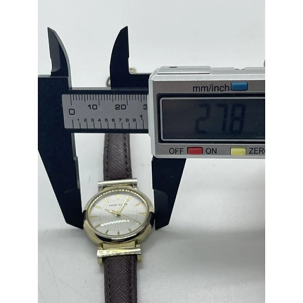 Anne Klein Women's Watch AK/2500 Round Gold Tone Case Brown Faux Leather Band